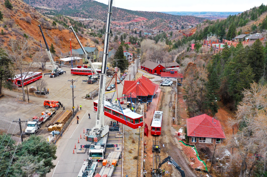 Cranes lifting trains