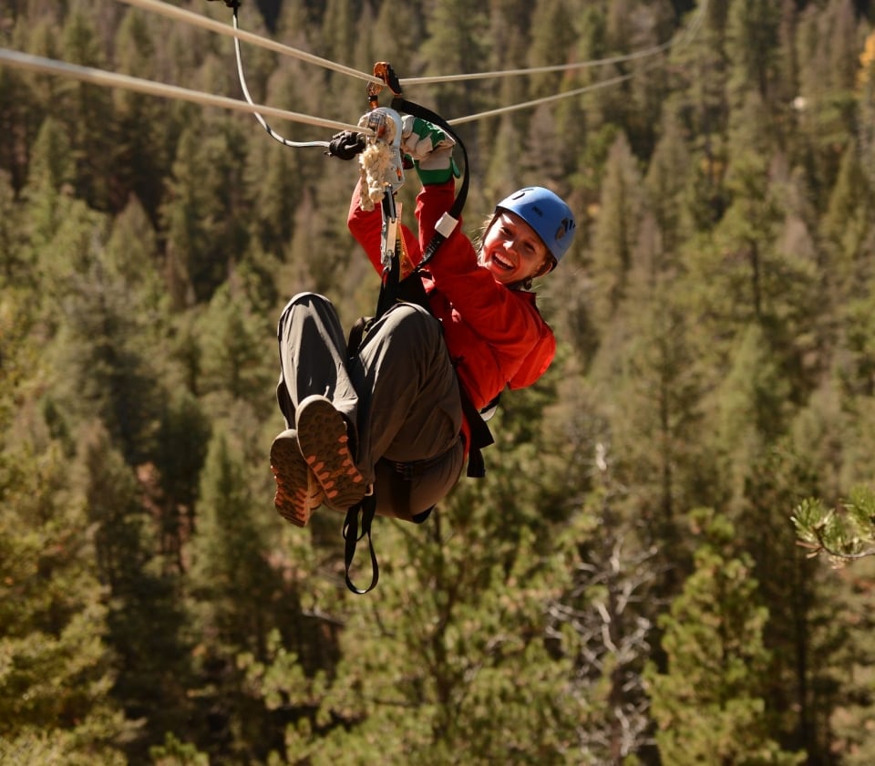 A woman ziplining at Soaring Adventures