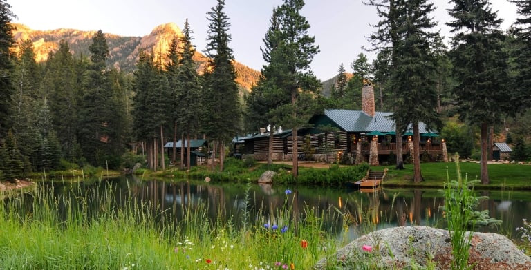 lodge next to lake at sunset