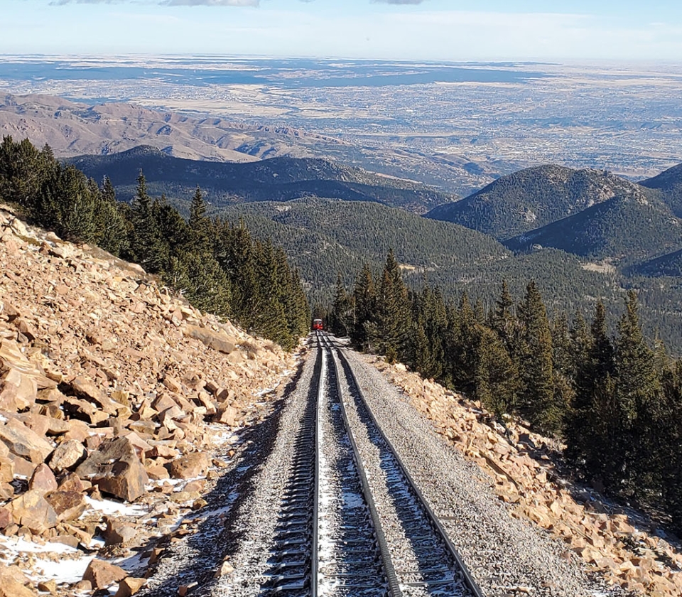A Train Track Going Through A Rocky Landscape
