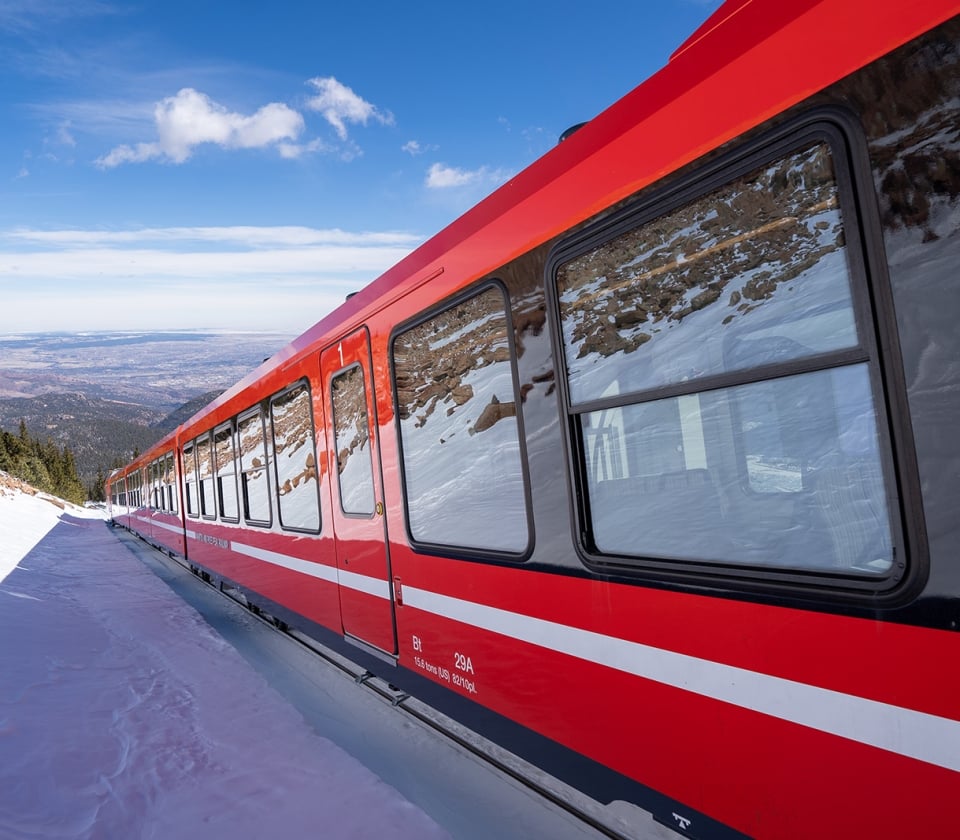 Red Train On Snowy Mountain